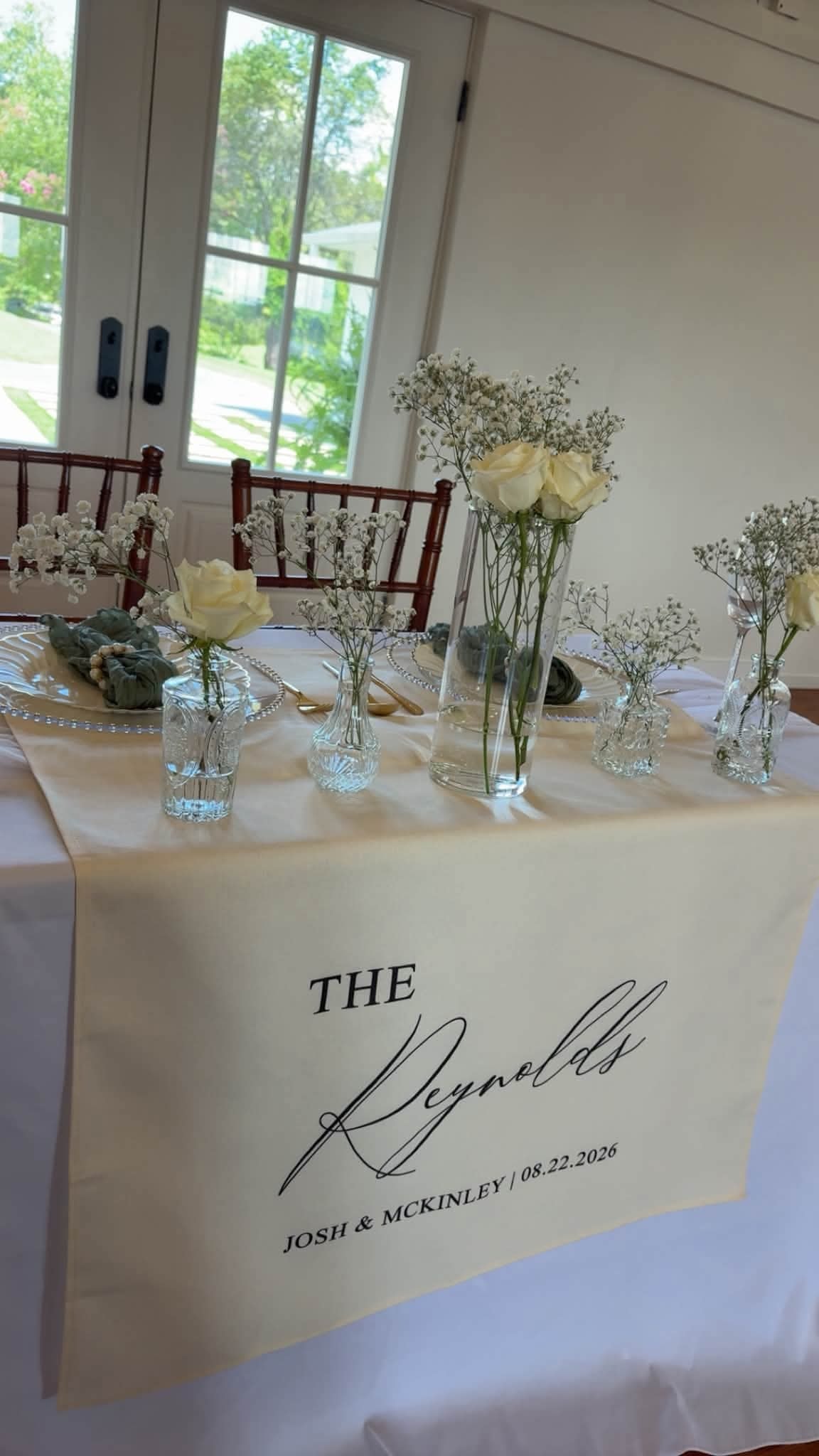 Sweetheart table with custom runner, white roses and baby's breath